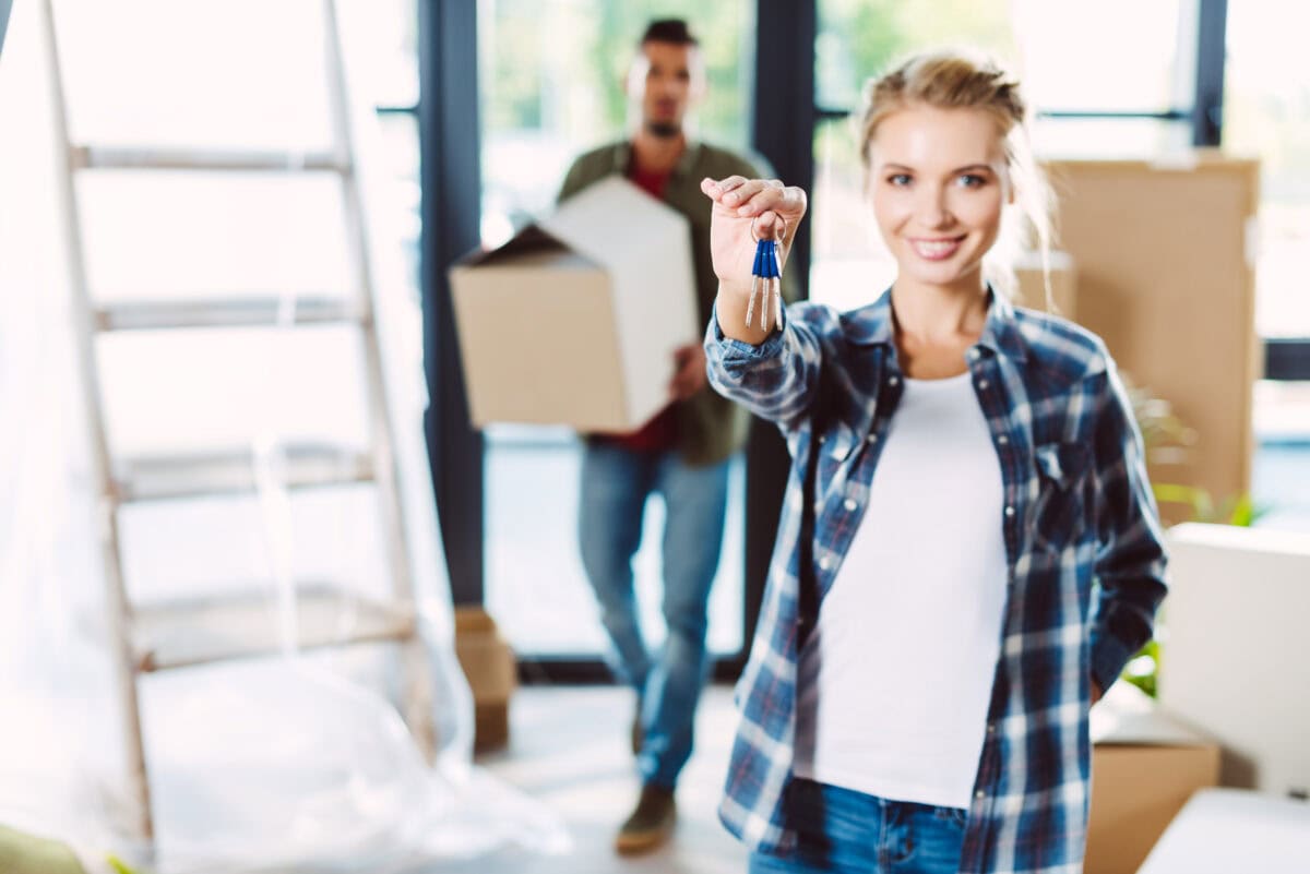 couple with keys in a new house