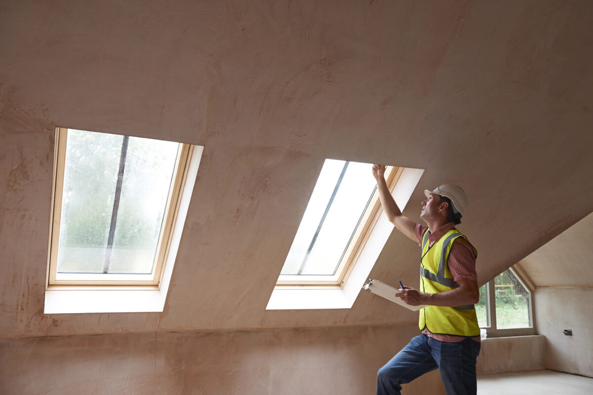 building inspector looking at new house